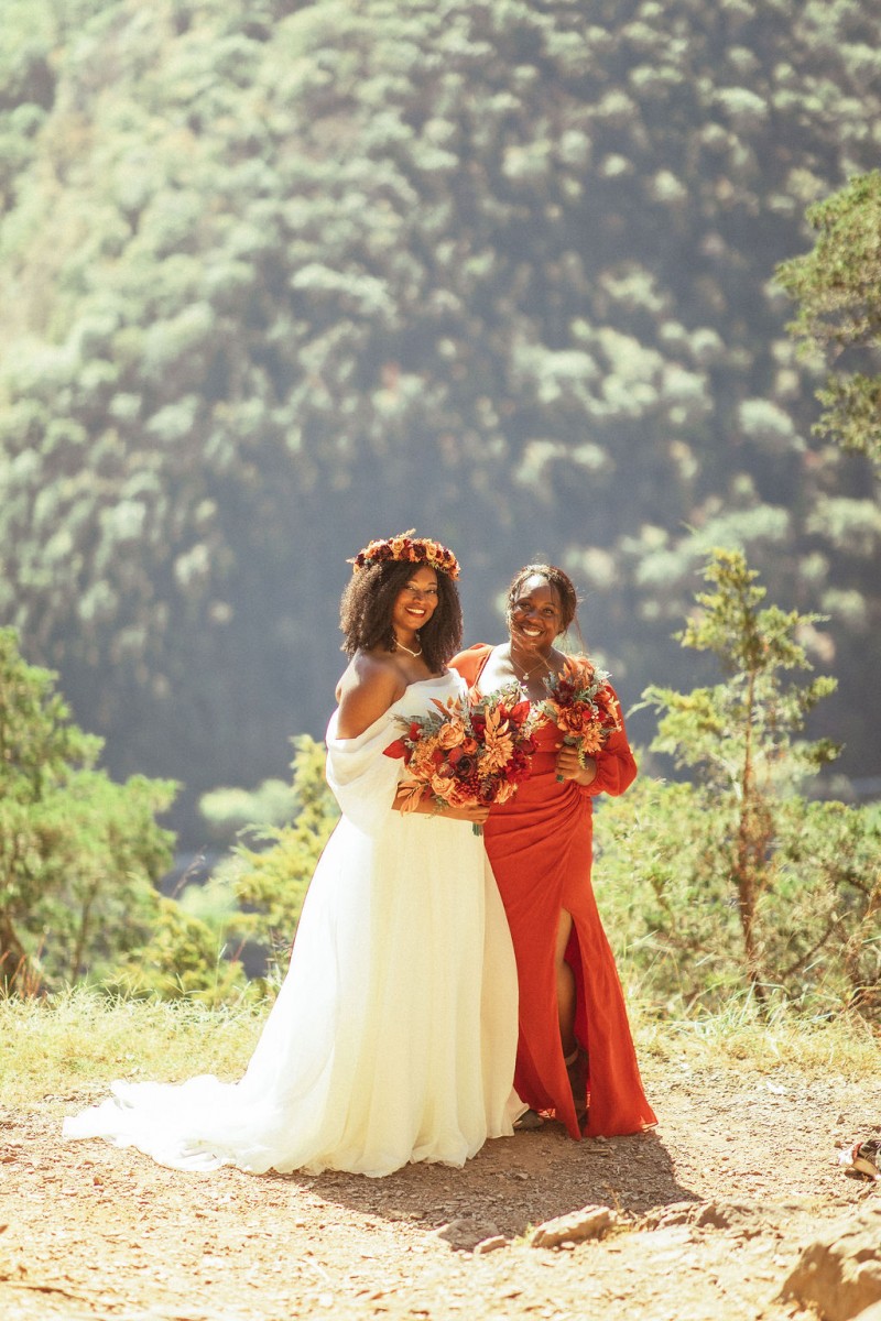 Coordinated wedding florals in rust burgundy cinnamon orange theme1024-1200