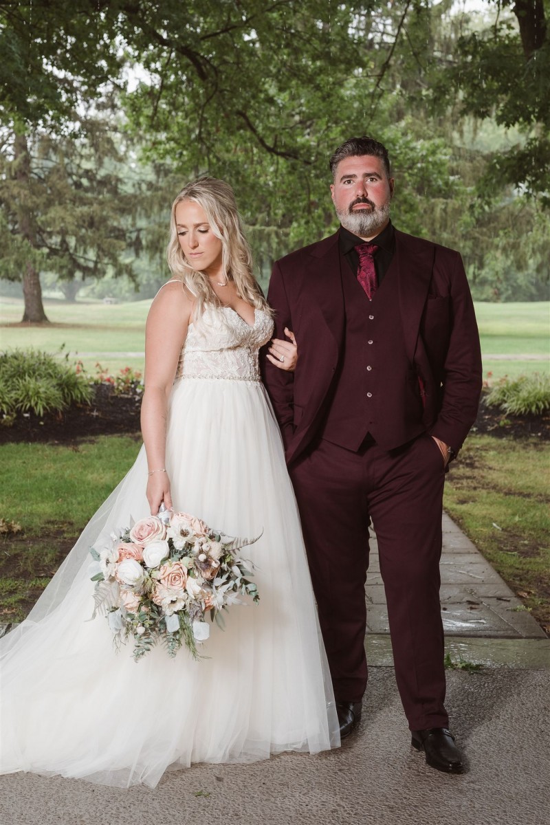 Wedding bouquet and groom boutonniere in blush pink, white, and beige for a romantic couple portrait1365-1200.293040293
