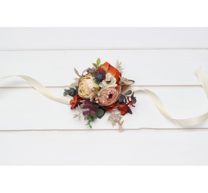 Wedding boutonnieres and wrist corsage in rust orange cream color scheme. Flower accessories. 5179