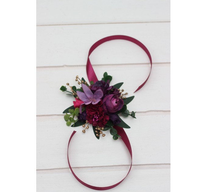 Wedding boutonnieres and wrist corsage in purple magenta gold color scheme. Flower accessories.5273