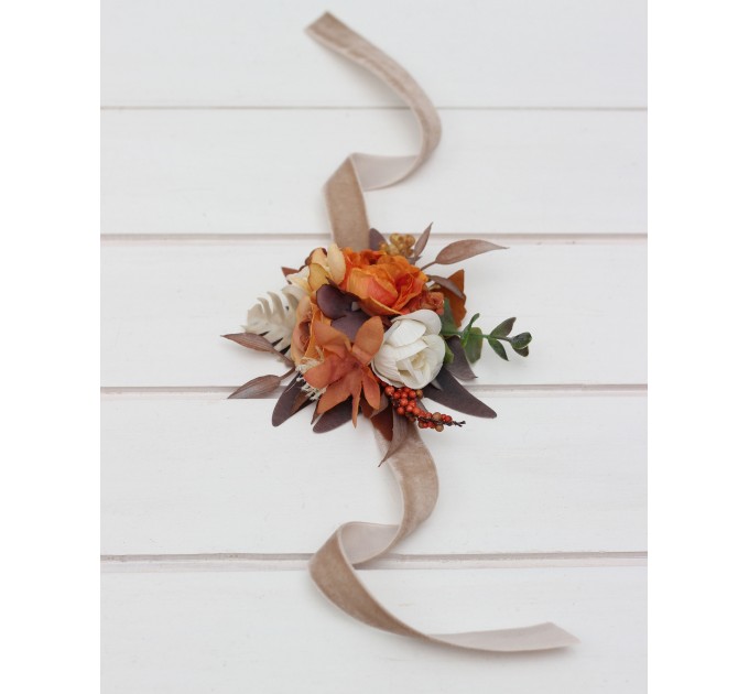 Wedding boutonnieres and wrist corsage in orange ivory rust terracotta color scheme. Flower accessories. 5140