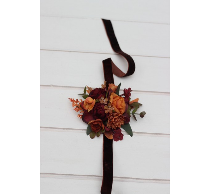 Wedding boutonnieres and wrist corsage in burgundy orange rust brown color scheme. Flower accessories. 5330