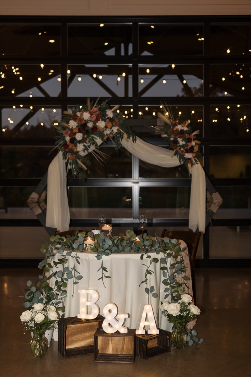 Boho wedding arch flowers with pampas grass, cinnamon roses, ivory dahlias, and burgundy accents2937-1200.1361933946