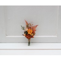 Wedding boutonniere in terracotta rust orange tones. 5331