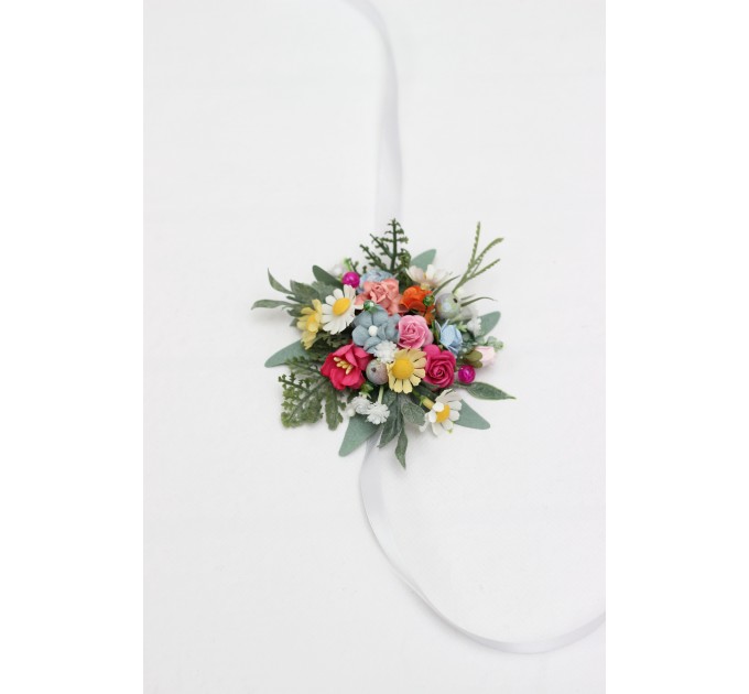 Colorful wrist corsage with wildflowers