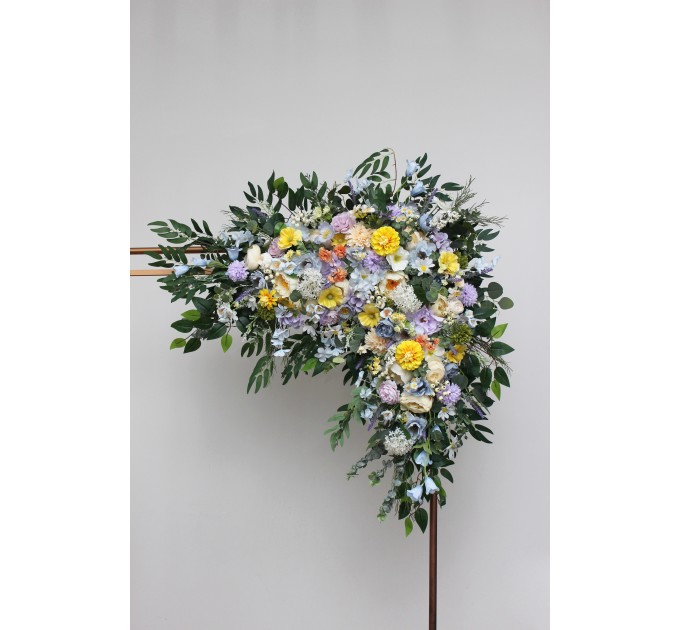 Wildflower arch flowers in yellow, ivory, dusty blue and lavender