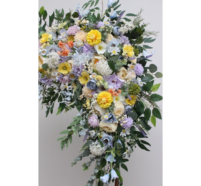 Wildflower arch flowers in yellow, ivory, dusty blue and lavender