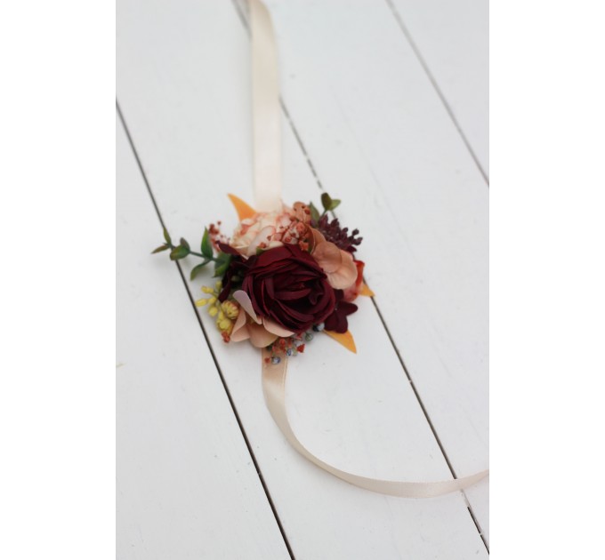 Wedding boutonnieres and wrist corsage in burgundy orange color scheme. Flower accessories. 5042