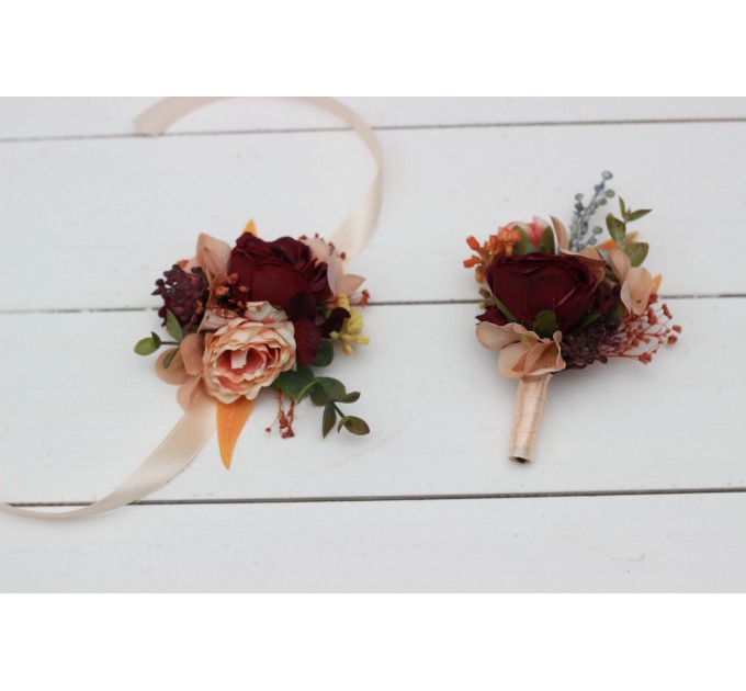 Wedding boutonnieres and wrist corsage in burgundy orange color scheme. Flower accessories. 5042