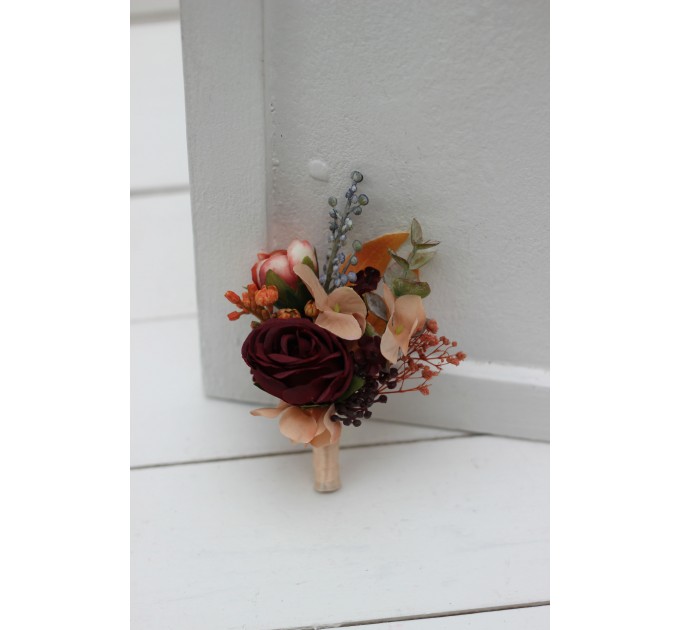 Wedding boutonnieres and wrist corsage in burgundy orange color scheme. Flower accessories. 5042
