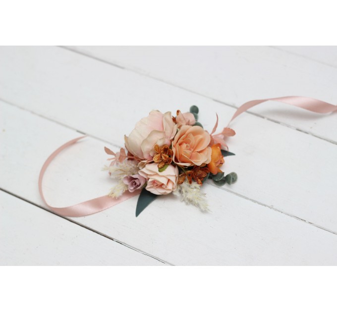 Wedding boutonnieres and wrist corsage in orange blush pink color scheme. Flower accessories. 5071