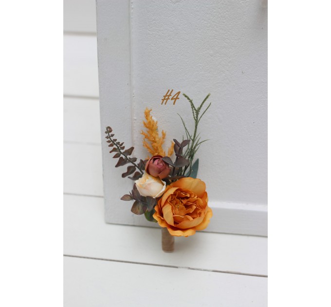 Wedding boutonnieres and wrist corsage in orange rust peach color theme. Flower accessories. 0001