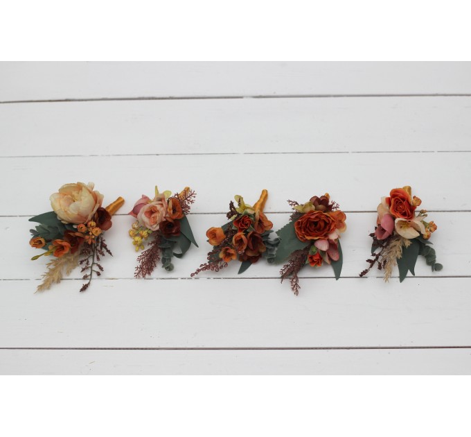 Wedding boutonnieres and wrist corsage in orange rust peach color theme. Flower accessories. 0001