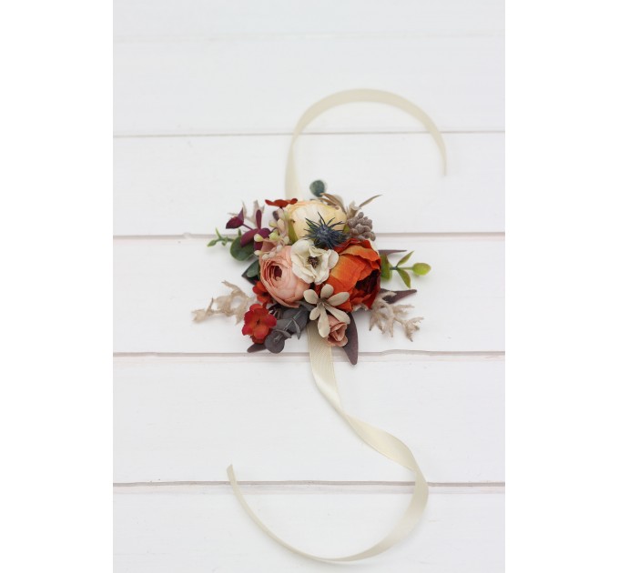 Wedding boutonnieres and wrist corsage in rust orange cream color scheme. Flower accessories. 5179