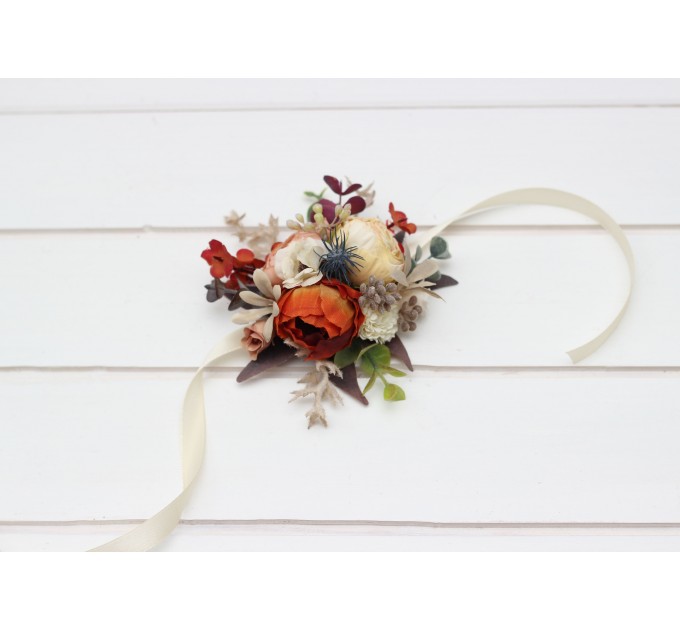 Wedding boutonnieres and wrist corsage in rust orange cream color scheme. Flower accessories. 5179
