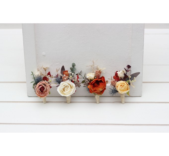 Wedding boutonnieres and wrist corsage in rust orange cream color scheme. Flower accessories. 5179