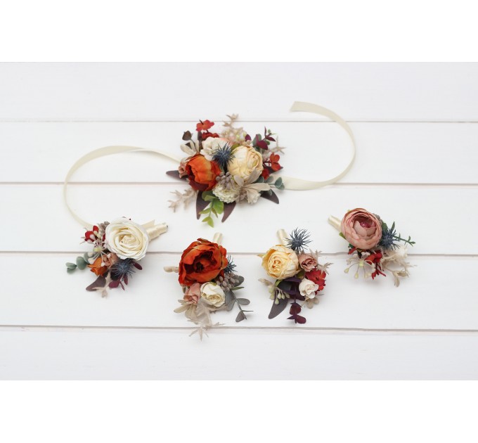 Wedding boutonnieres and wrist corsage in rust orange cream color scheme. Flower accessories. 5179