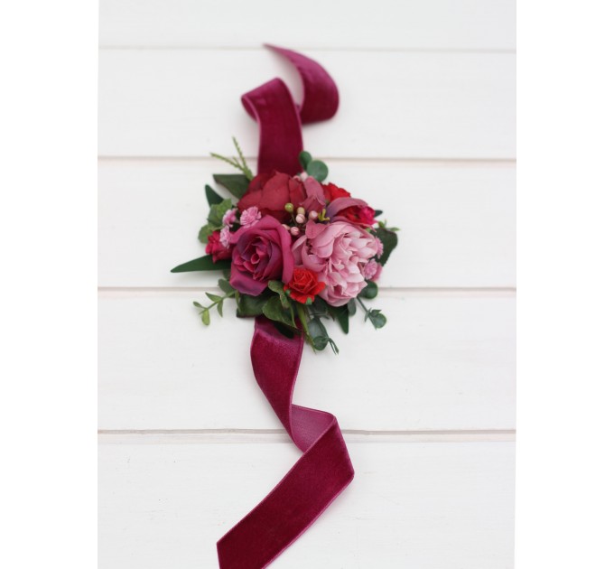 Wedding boutonnieres and wrist corsage in magenta pink red color scheme. Flower accessories. 5280