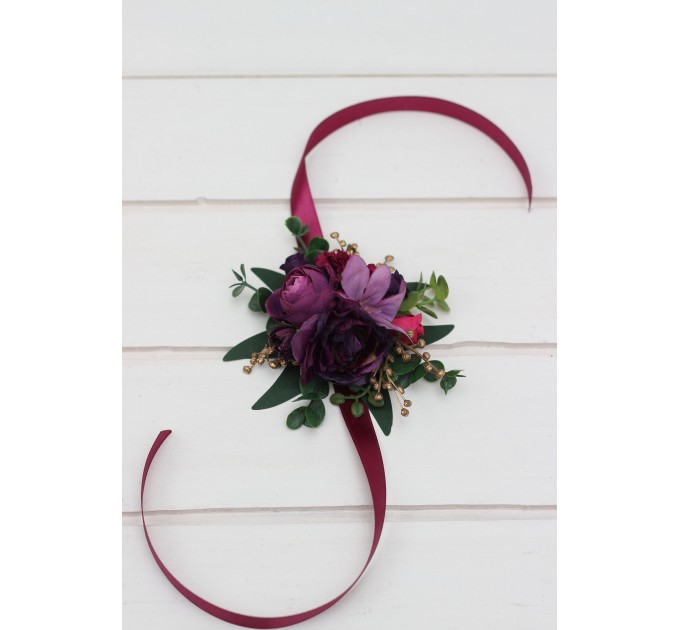 Wedding boutonnieres and wrist corsage in purple magenta gold color scheme. Flower accessories.5273