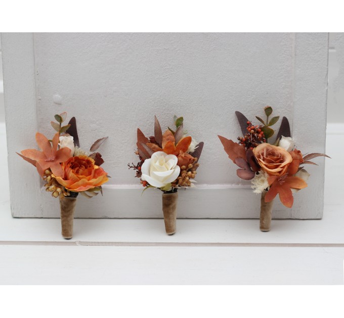 Wedding boutonnieres and wrist corsage in orange ivory rust terracotta color scheme. Flower accessories. 5140