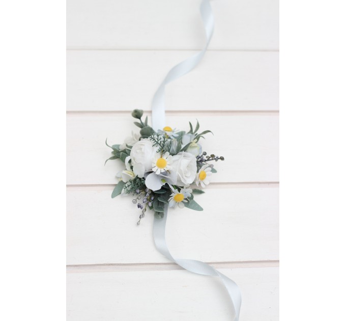 Wedding boutonnieres and wrist corsage in white sky blue color scheme. Flower accessories. 5253
