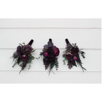 Wedding boutonnieres and wrist corsages in a black, purple, and magenta color palette. Floral accessories for a bold and elegant look.  5370
