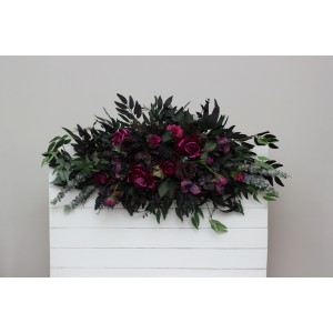 Purple, black, magenta, and green flower arrangement for a Halloween or Gothic wedding. Floral arch top decor, archway flowers. 5370