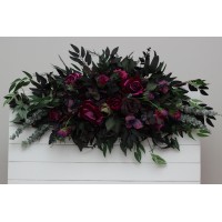 Purple, black, magenta, and green flower arrangement for a Halloween or Gothic wedding. Floral arch top decor, archway flowers. 5370