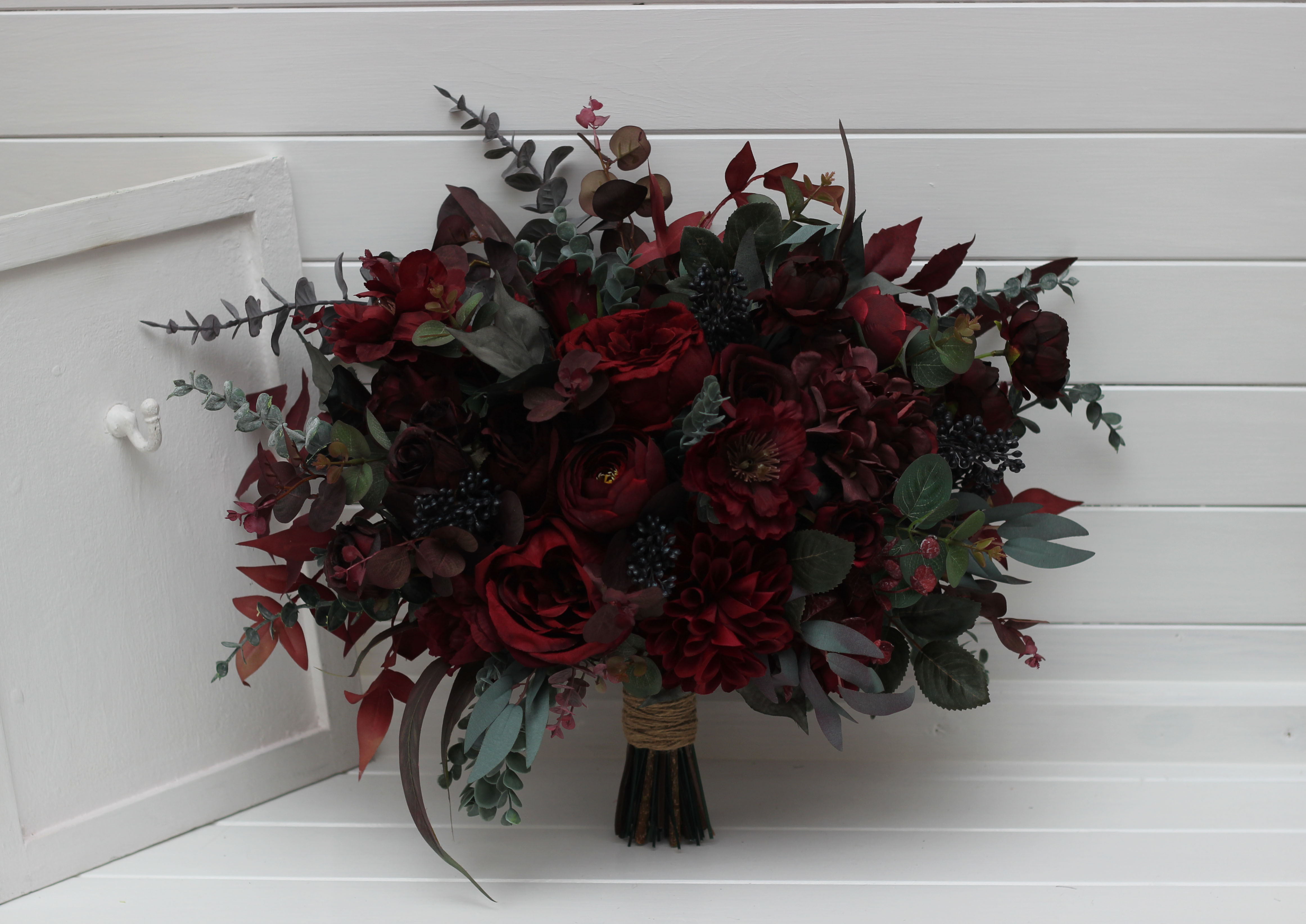 Burgundy wedding arch flowers