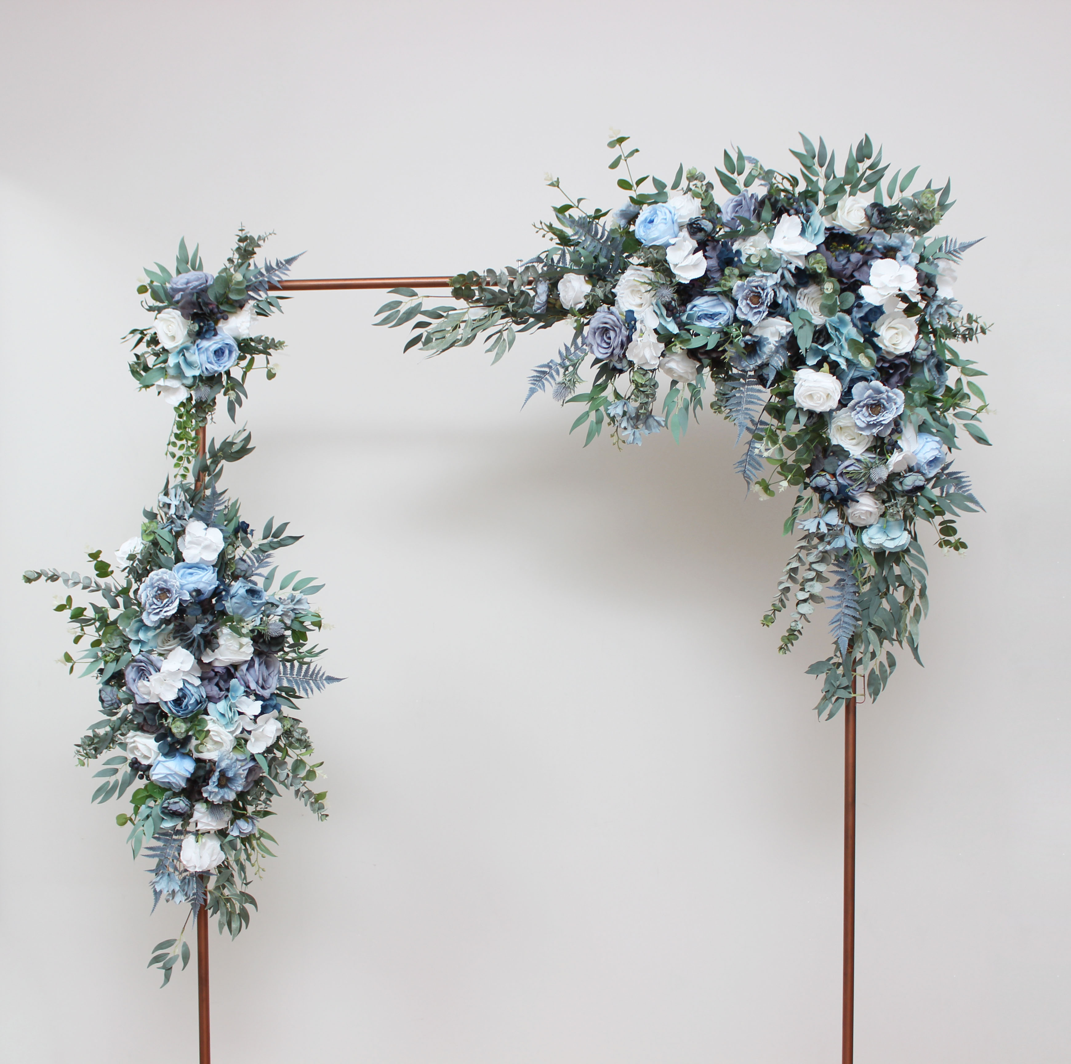 Dusty blue and white wedding arch flowers