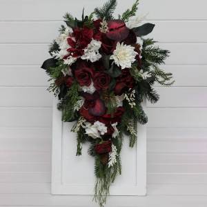 Winter cascading bouquet with burgundy ivory and pine. 5448