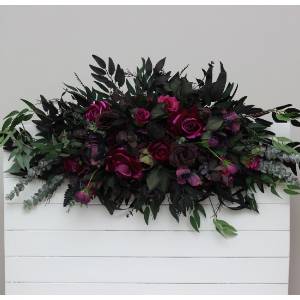 Purple, black, magenta, and green flower arrangement for a Halloween or Gothic wedding. Floral arch top decor, archway flowers. 5370