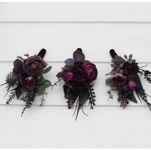 Wedding boutonnieres and wrist corsages in a black, purple, and magenta color palette. Floral accessories for a bold and elegant look.  5370